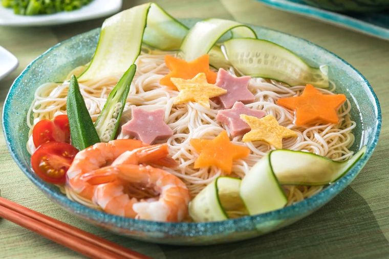 Decorative somen noodle bowl with shrimp, cucumber, tomato, and star-shaped carrot garnish