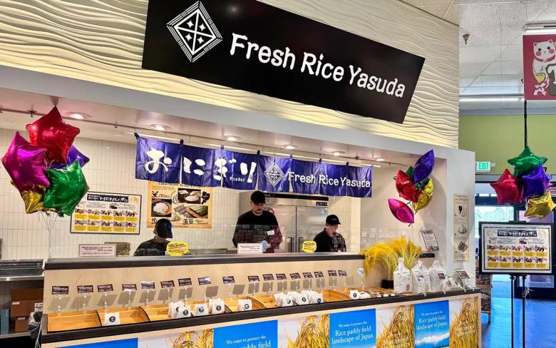 Fresh Rice Yasuda storefront with counter staff, rice displays, and decorative balloons in grocery mall