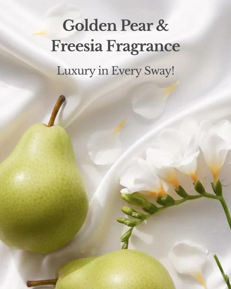 Golden pear and white freesia flowers on luxury fragrance product packaging