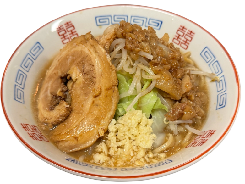 Bowl of ramen with chashu pork, egg, bean sprouts, and scallions in broth
