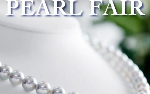 Uwajima Pearl Fair promotional banner featuring white pearl necklace and mascot character