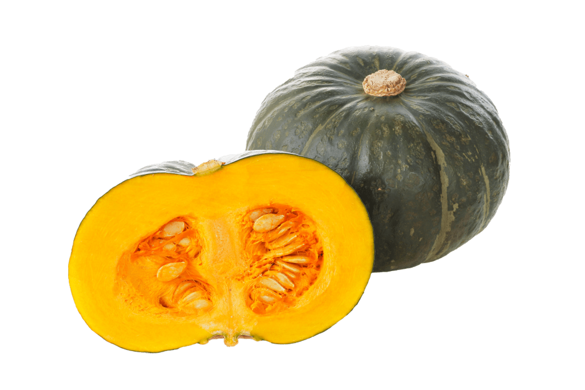 Kabocha squash whole and halved showing bright yellow flesh and seeds against black background