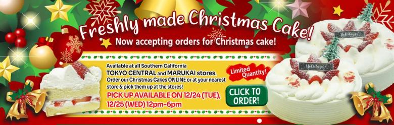Freshly made Christmas cake promotional banner with festive decorations and ordering information