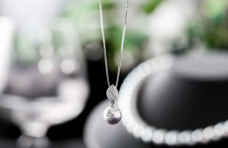 Silver pearl pendant necklace with diamond accent on delicate chain