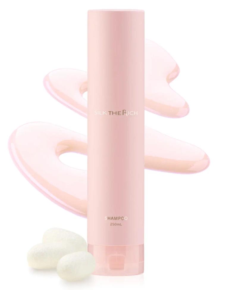 Pink shampoo bottle 250mL with silk texture swatches and white ingredients displayed