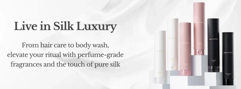 Luxury silk beauty products collection with hair care and body wash in pink and black bottles