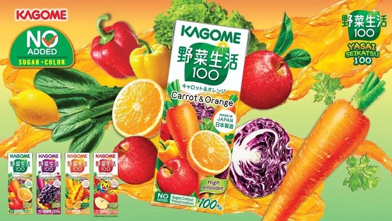 Kagome vegetable juice product display with carrots, oranges, peppers and fresh vegetables