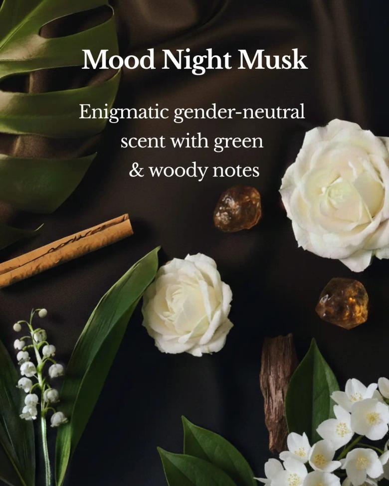 Mood Night Musk fragrance product display with white roses, green leaves, cinnamon, and woody elements